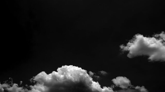separate white clouds on a black background have real clouds. White cloud isolated on a black background realistic cloud.