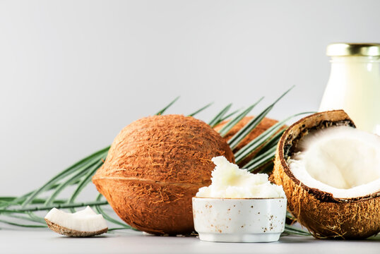 MCT Coconut butter or hard oil. Organic healthy food, beauty and SPA product. Gray background