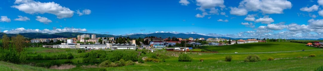 Fototapeta na wymiar Panoramic view of the small town Csikszereda in hungarian, Miercurea Ciuc in romanian , on a sunny day.