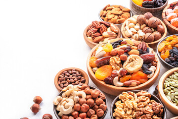 Nuts and dried fruits. Dried apricots, figs, raisins, pecans, walnuts, hazelnuts, almonds and other. White background, top view