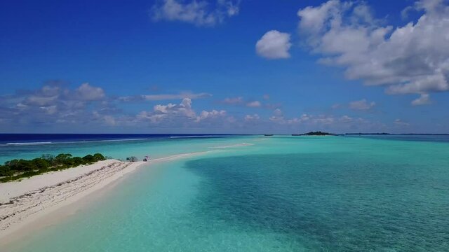 Maldives beach. Sunny tropical beach. Hot afternoon on an empty beach. Crystal clear blue water in the ocean. The best beaches in the world. DParadise place for relax. Drone aerial shot