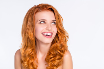 Photo portrait of pretty girl with wavy ginger hair laughing dreamy looking empty space isolated on white color background
