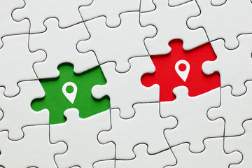 Missing puzzle pieces with map pin location pointer icons. GPS navigation technology