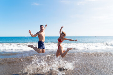 Happy young couple at the sea vacations