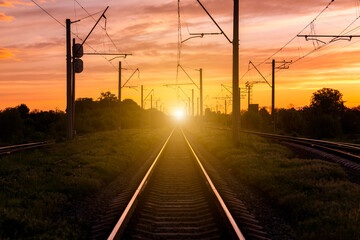 Plakat Railroad at sunset. Rail Freight and Passenger Transportation.