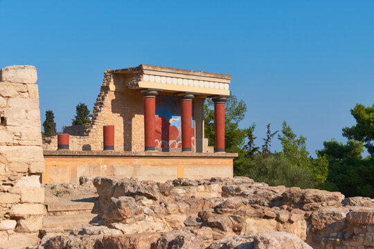 Temple of Cnossos on Crete island, Greece. Ruins of famous Minoan palace with trees in the background