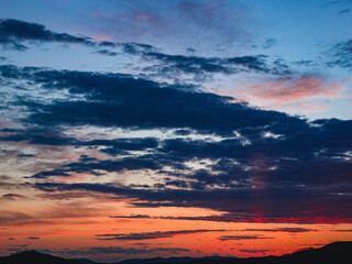 Dramatic sunset with clouds.