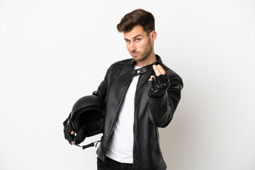 Young caucasian man with a motorcycle helmet isolated on white background making money gesture