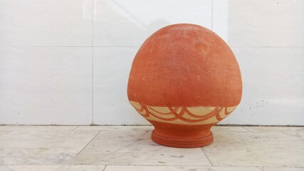 round earthen pot with white background