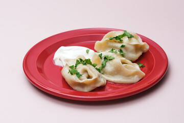 handmade dumplings on a pink background