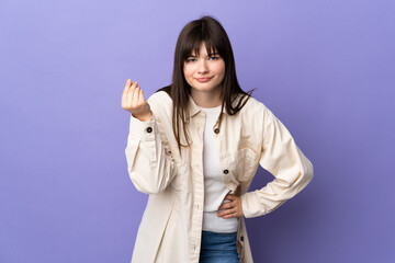 Young Ukrainian woman isolated on purple background making Italian gesture