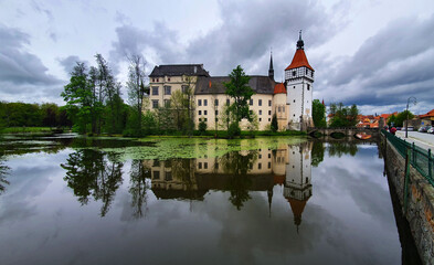 Fototapeta na wymiar Blatná castle in the Czech Republic stock images. Beautiful castle reflection in the water images photo. Medieval monument in the Czech Republic. Famous place in czechia images