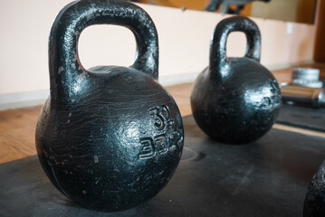 Fototapeta na wymiar dumbbells and kettlebells for heavy gym training