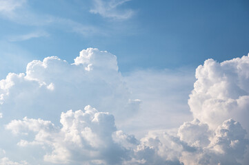 Naklejka na ściany i meble Cumulus white clouds on blue sky