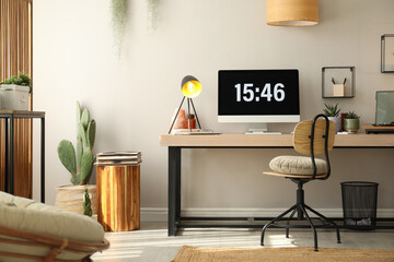 Room interior with comfortable workplace. Modern computer on wooden desk