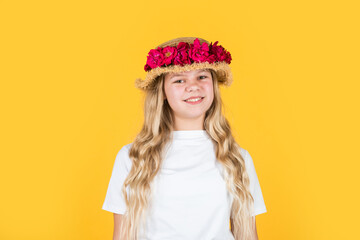 natural beauty. cheerful child in summer clothes. spring kid fashion. girl with rose flowers.