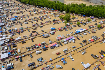 Aerial panorama view on flea market with miscellaneous items and crowds of buyers and sellers in Englishtown NJ USA