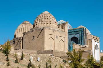 View from the side of the old cemetery to the monument of medieval architecture Shahi-Zinda - the ensemble of mausoleums of the Karakhanid and Timurid nobility. Samarkand, Uzbekistan