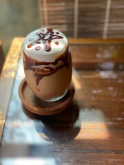 Mocha Coffee with milk foam whipped on top. Cafe concept menu