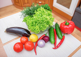 Vegetables on the kitchen table. Healthy food products on the table in the kitchen.