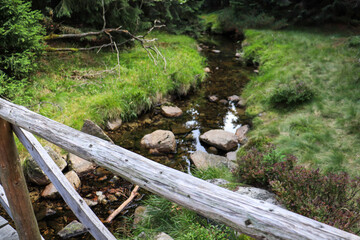 stream in the mountain, wooden bridge 