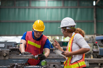 Group of male and female worker maintenance machine in industry factory. Technician worker working,...