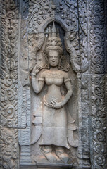 Та Prohm is the temple, it rains in the rainy season.The preserved symbiosis of stone and wood allows us to see Ta Prohm in this form.Bas-relief.(Cambodia, 04.10. 2019).