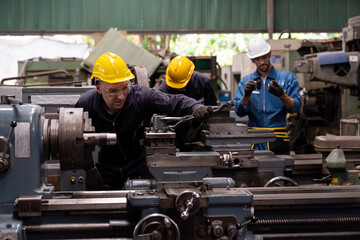 Group of male engineer worker maintenance machine in industry factory. Male technician worker...