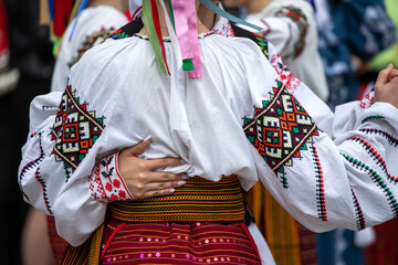 Ukrainian national clothing - embroideries. Young people in embroidered shirts dance