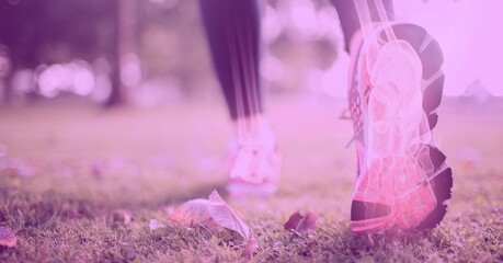 Composition of woman's legs running with visible x ray bones and pink tint