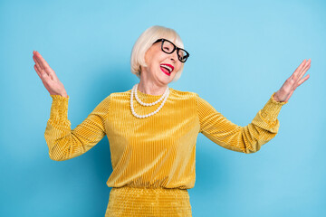 Photo of funny short hairdo aged lady dance wear blouse eyewear isolated on blue color background