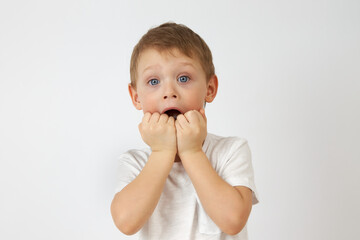 The little boy with the blue eyes put his hands in his mouth, startled. Children's fears