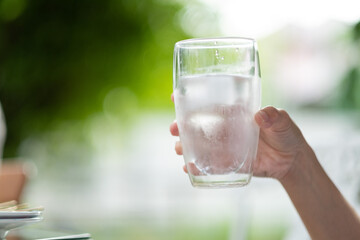 closeup hand drinking fresh water, healthcare concept