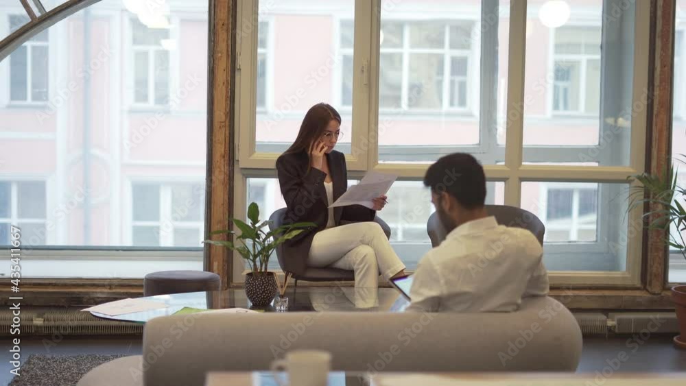 Poster caucasian female employee using cellphone device for communicate and discuss paperwork in office, pr