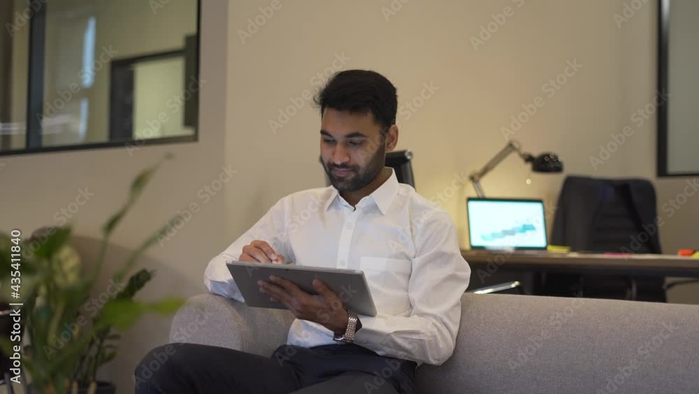 Poster turkish employee searching data information on digital tablet technology using office internet conne