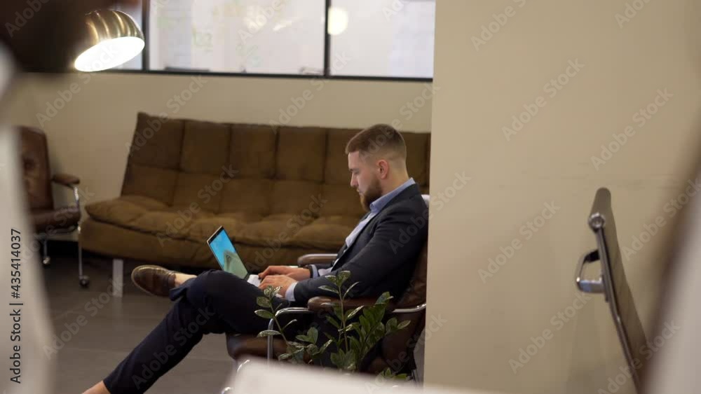 Poster caucasian male executive manager using laptop computer for online messaging and web banking while pr