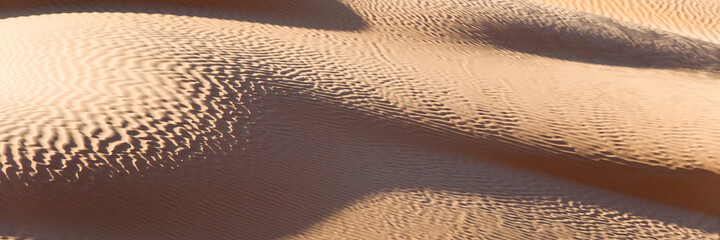 Abstract sand dunes panorama, desert of Sahara, South Tunisia