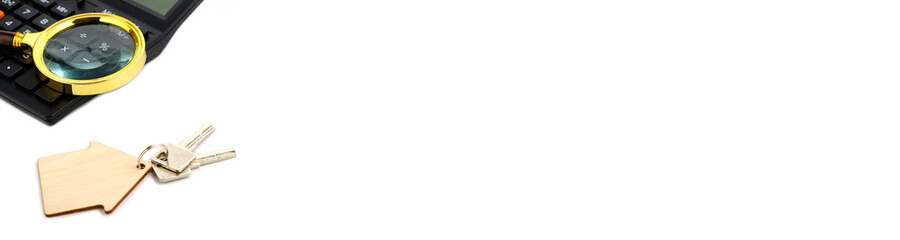 Banner and panorama Calculator and apartment keys On a whit background Concept of Selling Renting Buying Apartment or house