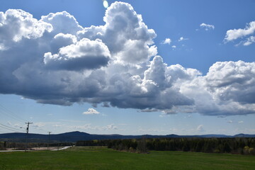 Fototapeta na wymiar A cloudy sky on the first summer day, Sainte-Apolline, Québec