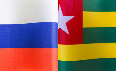 fragments of the national flags of Russia and the Togolese Republic close-up