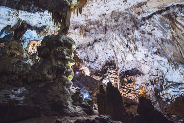 Underground cave, amazing scene , view of stalactites and stalagmite underground , formation inside.