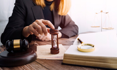Business and lawyers discussing contract papers with brass scale on desk in office. Law, legal services, advice, justice and law concept picture with film grain effect