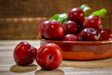 Fresh Plum Fruit on wooden