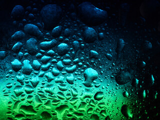 Fototapeta na wymiar 水色のライトに照らされる水滴