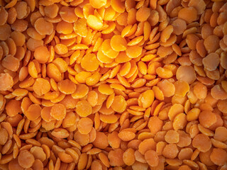 Bright red lentils close-up. Background copy space.
