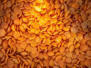 Bright red lentils close-up. Background copy space.