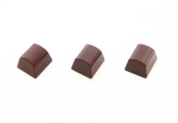 sweet chocolate candies with filling on a white background