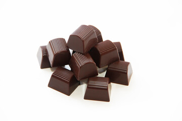 sweet chocolate candies with filling on a white background
