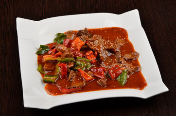 stewed vegetables with meat in tomato sauce with spices and gravy