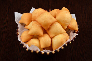 small buns fried in oil in a basket
